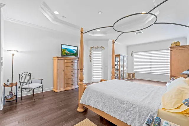 a spacious bathroom with a tub sink and mirror