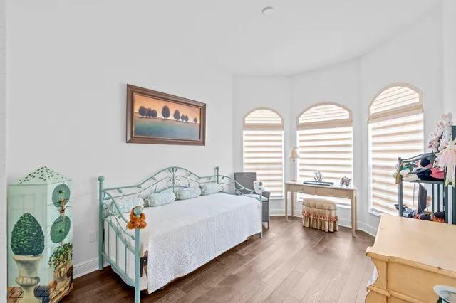 a bathroom with a sink a toilet a mirror and shower