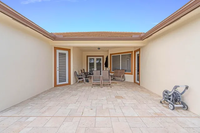 a dining room with furniture and garden view