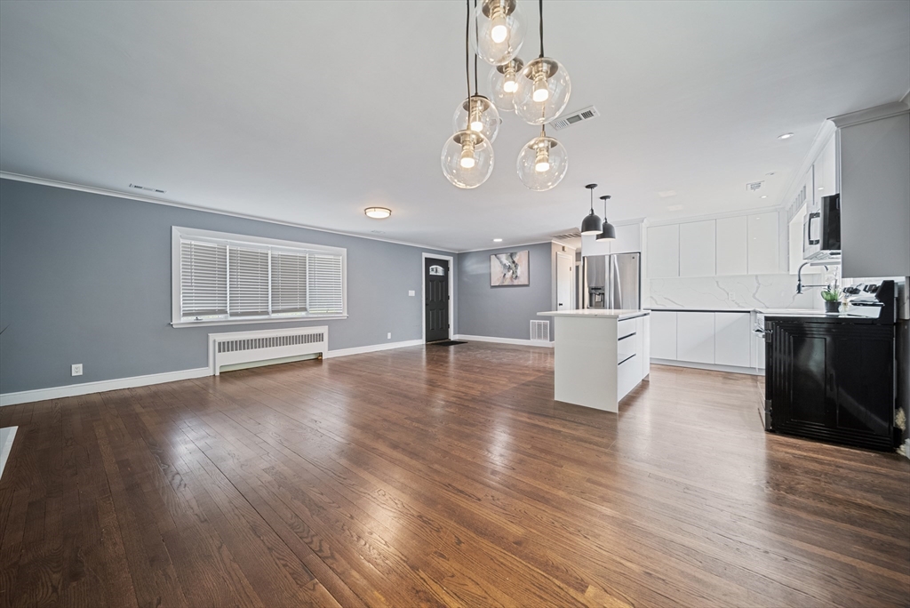 123 Walnut Street Saugus, MA 01906 - Photo 11 of 38 a view of a kitchen with wooden floor and a kitchen