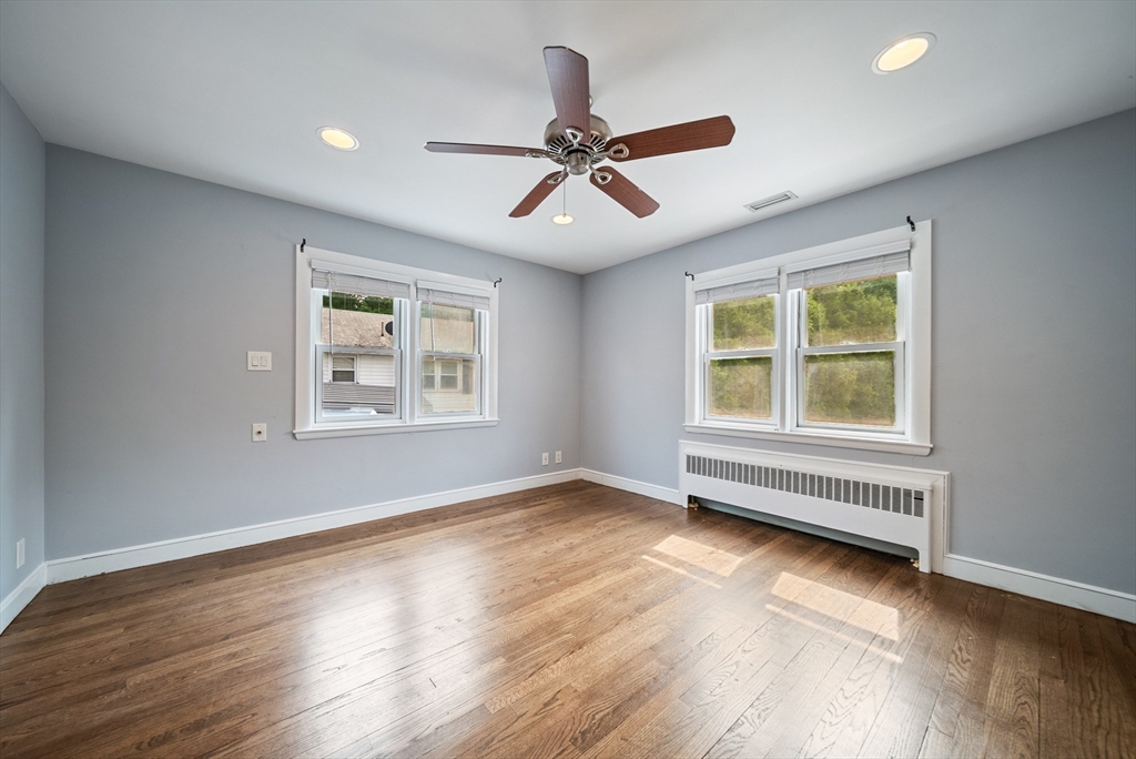 123 Walnut Street Saugus, MA 01906 - Photo 16 of 38 a view of an empty room with wooden floor and a window