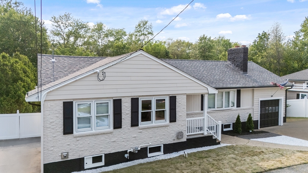 123 Walnut Street Saugus, MA 01906 - Photo 2 of 38 a front view of a house with garden