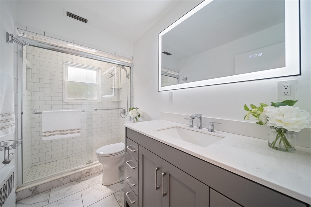 123 Walnut Street Saugus, MA 01906 - Photo 21 of 38 a bathroom with a sink a toilet and shower