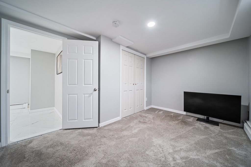 123 Walnut Street Saugus, MA 01906 - Photo 29 of 38 a view of a livingroom with an empty space and a flat screen tv