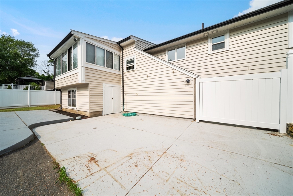123 Walnut Street Saugus, MA 01906 - Photo 36 of 38 a view of a house with a backyard