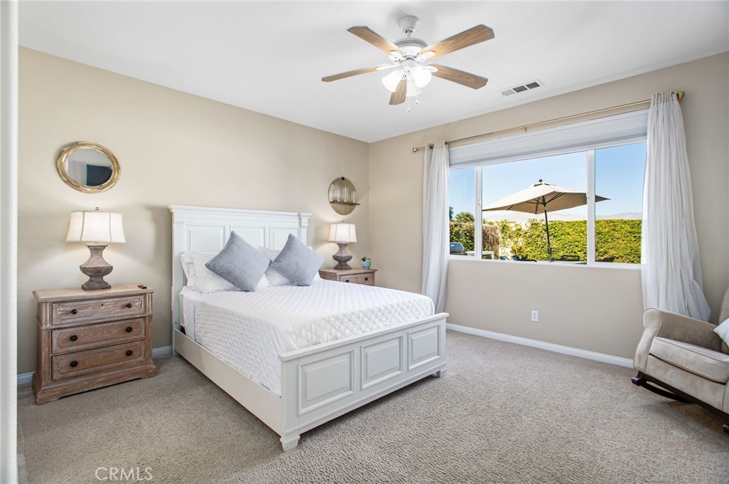 84146 Olona Court Indio, CA 92203 - Photo 11 of 35 a bedroom with a bed and a window