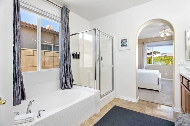 a bathroom with a tub and a window