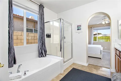 a bathroom with a tub and a window