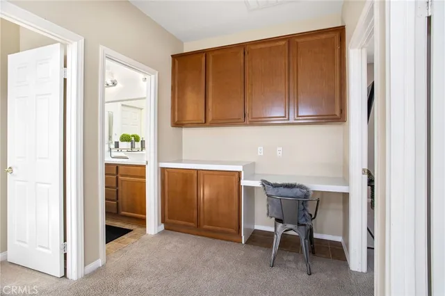 a view of room with window and furniture