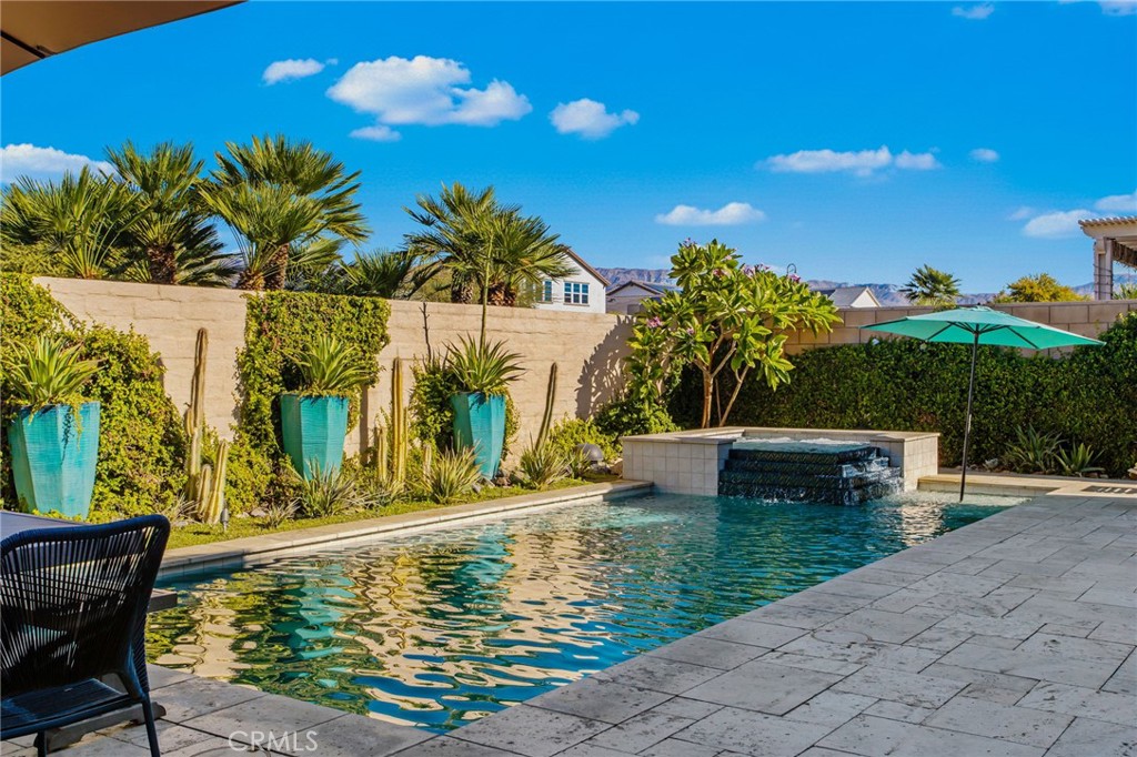 84146 Olona Court Indio, CA 92203 - Photo 25 of 35 a view of a swimming pool with a patio