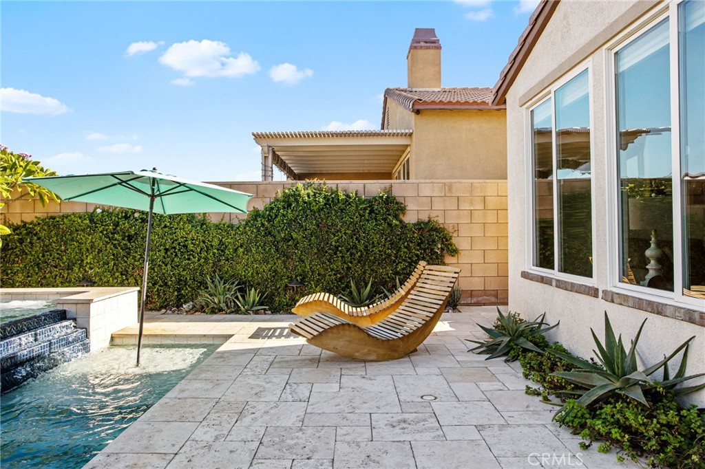 84146 Olona Court Indio, CA 92203 - Photo 27 of 35 a view of a chair and fire pit in the patio with a backyard