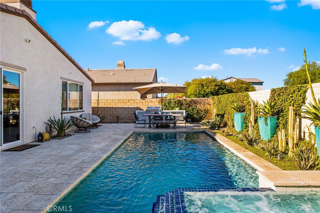 84146 Olona Court Indio, CA 92203 - Photo 28 of 35 a view of a house with backyard porch and sitting area