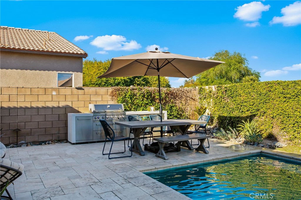 84146 Olona Court Indio, CA 92203 - Photo 29 of 35 a patio with table and chairs