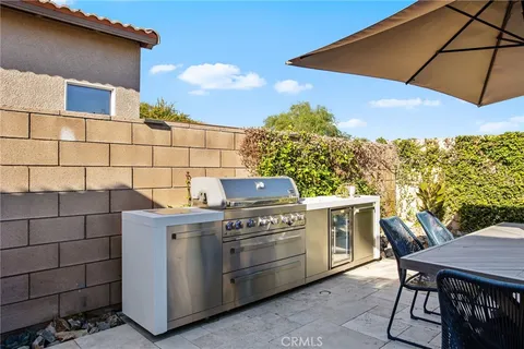 a view of a patio with table and chairs