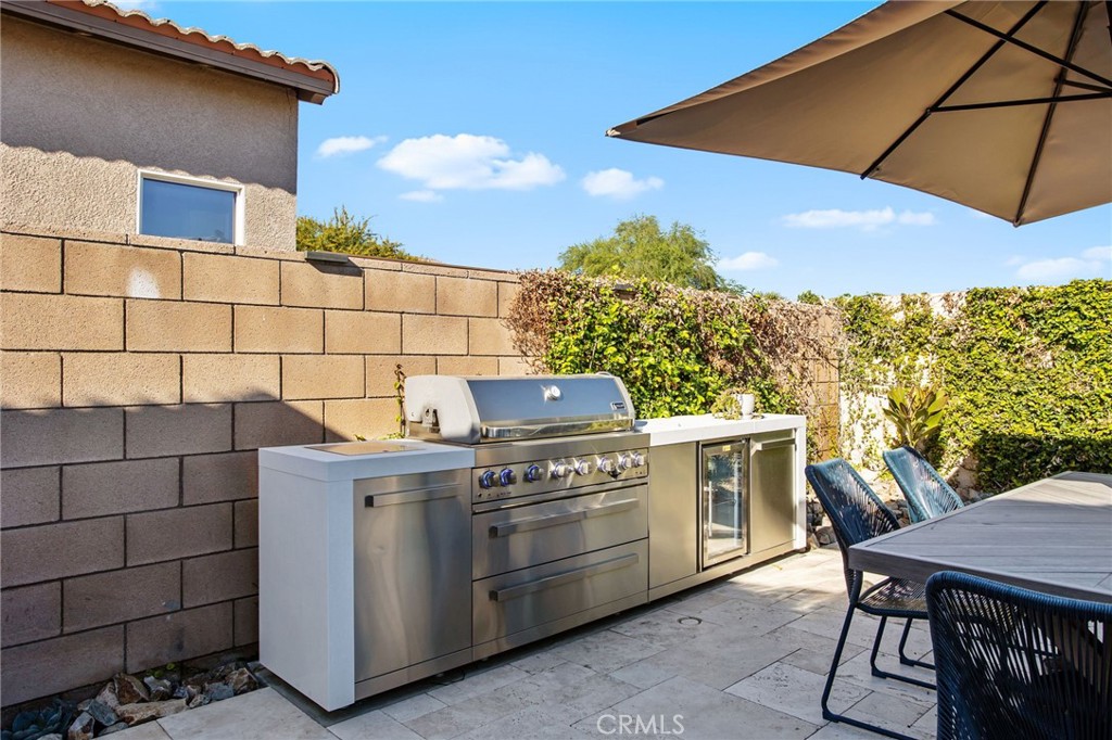 84146 Olona Court Indio, CA 92203 - Photo 30 of 35 a view of a patio with table and chairs