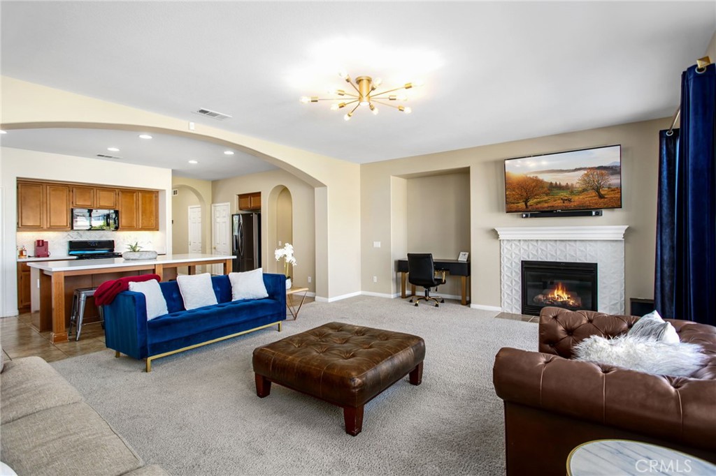 84146 Olona Court Indio, CA 92203 - Photo 10 of 35 a living room with furniture and a fireplace