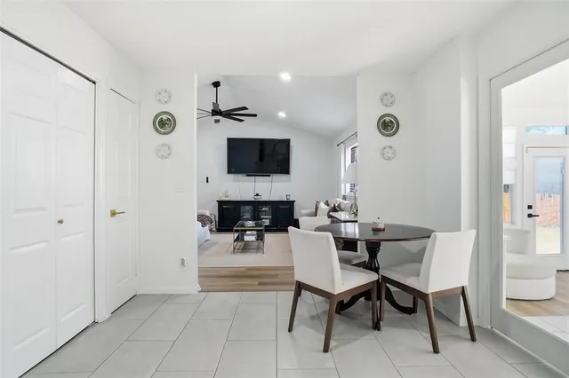 a kitchen with a sink window and stainless steel appliances