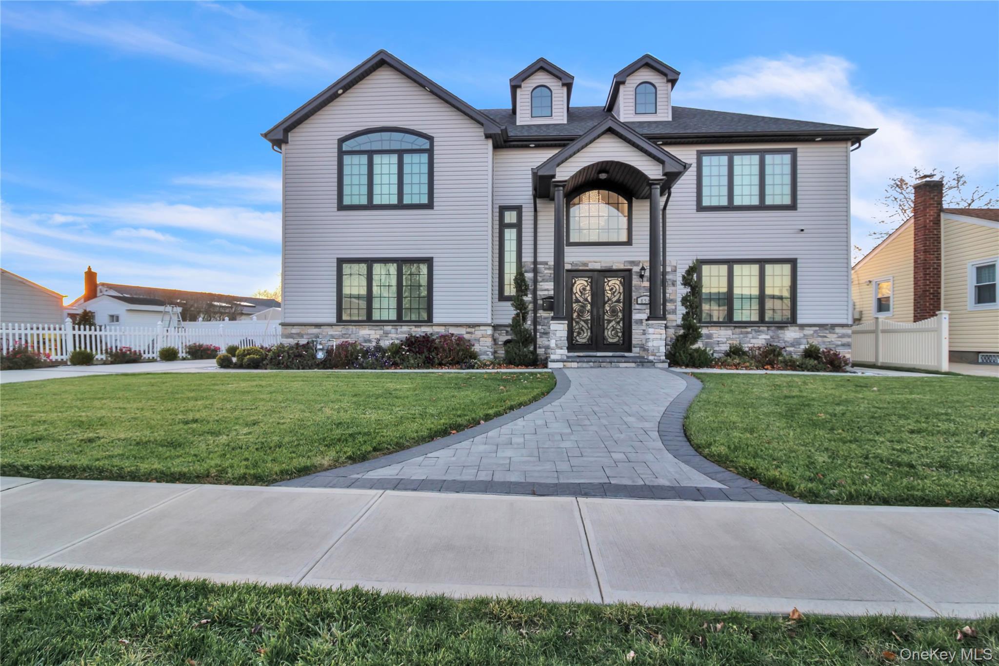 View of front of house with stone siding