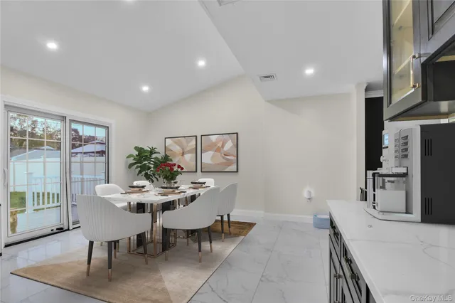 a kitchen with stainless steel appliances kitchen island granite countertop a sink and cabinets