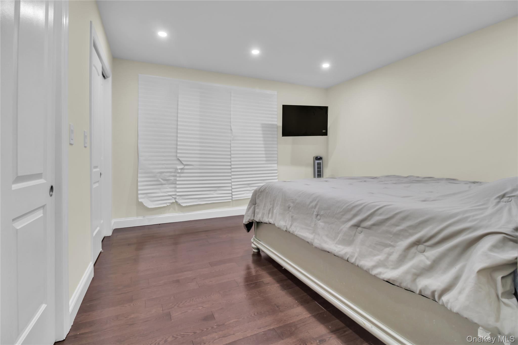 858 Prescott Street Valley Stream, NY 11580 - Photo 18 of 48 Bedroom featuring dark wood-style floors and recessed lighting