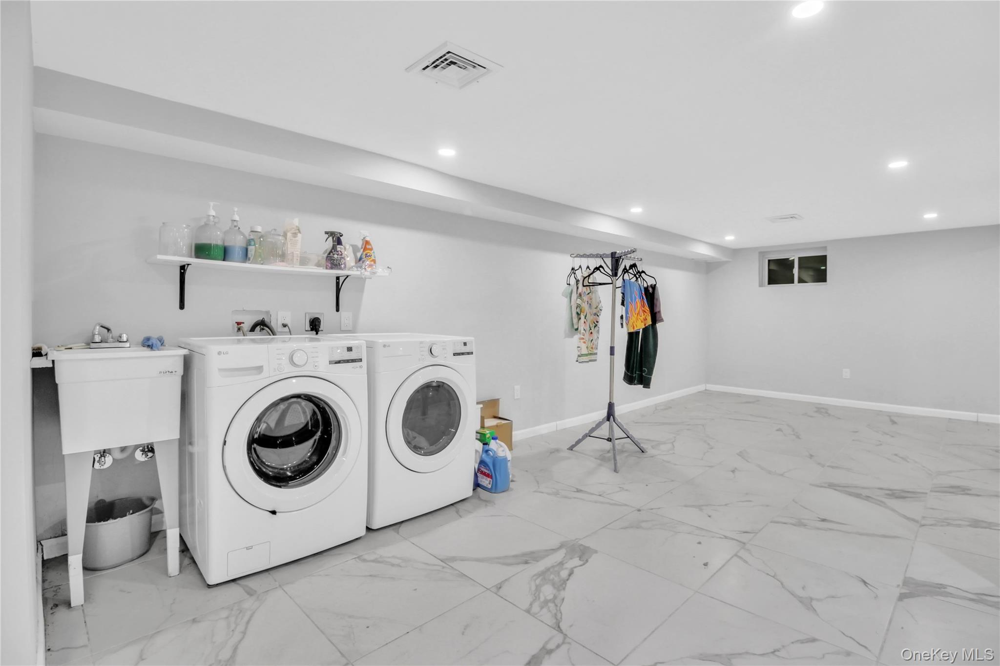 858 Prescott Street Valley Stream, NY 11580 - Photo 36 of 48 Laundry room with light marble finish floors, separate washer and dryer, and recessed lighting