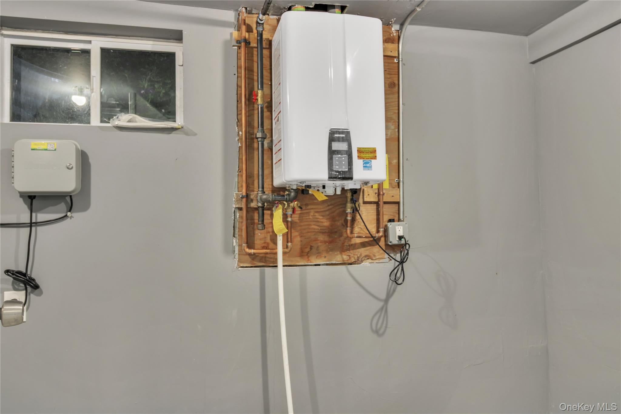 858 Prescott Street Valley Stream, NY 11580 - Photo 38 of 48 Utility room with water heater