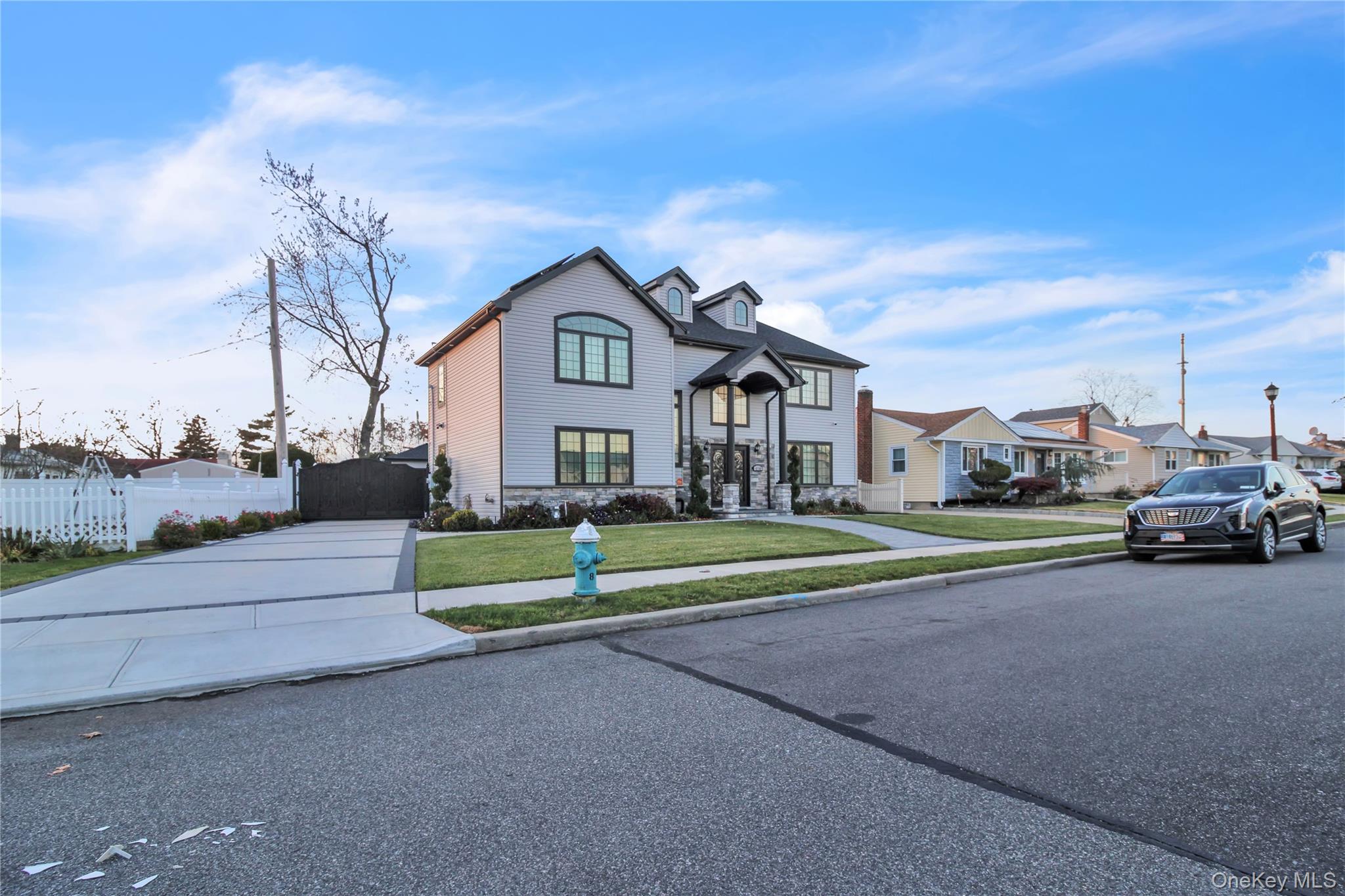 858 Prescott Street Valley Stream, NY 11580 - Photo 40 of 48 View of front of house featuring concrete driveway and a residential view