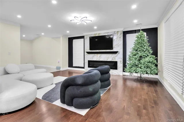 a living room with furniture and flowers