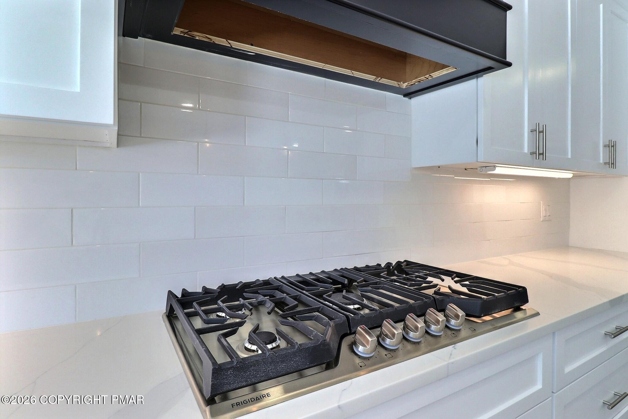 230 Colbert Street Stroudsburg, PA 18360 - Photo 12 of 43 a close up of a stove top oven sitting inside of a kitchen