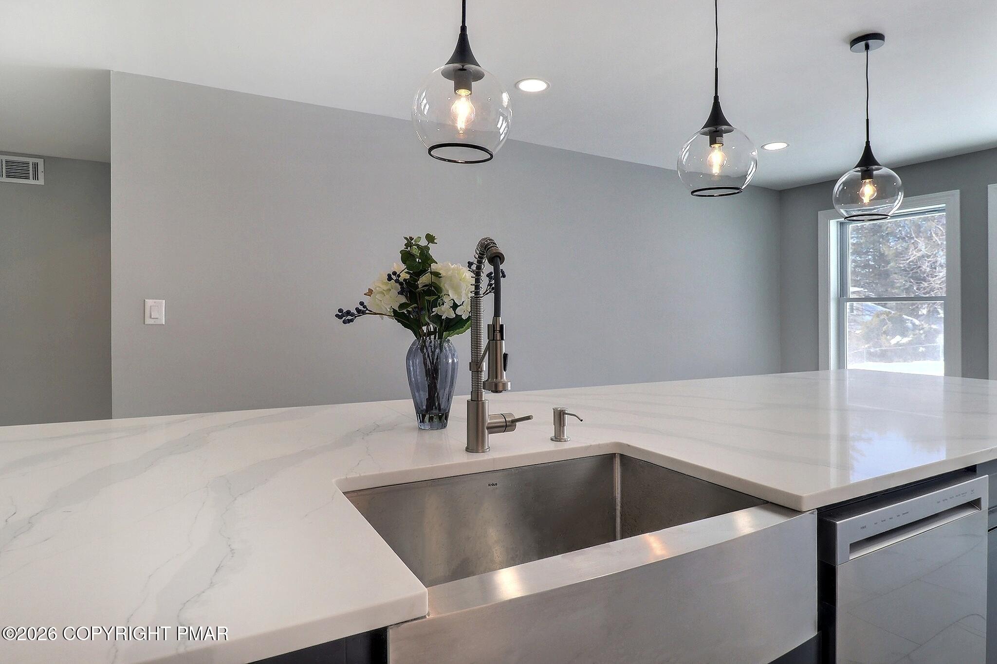 230 Colbert Street Stroudsburg, PA 18360 - Photo 13 of 43 a view of a counter top a sink and chandelier