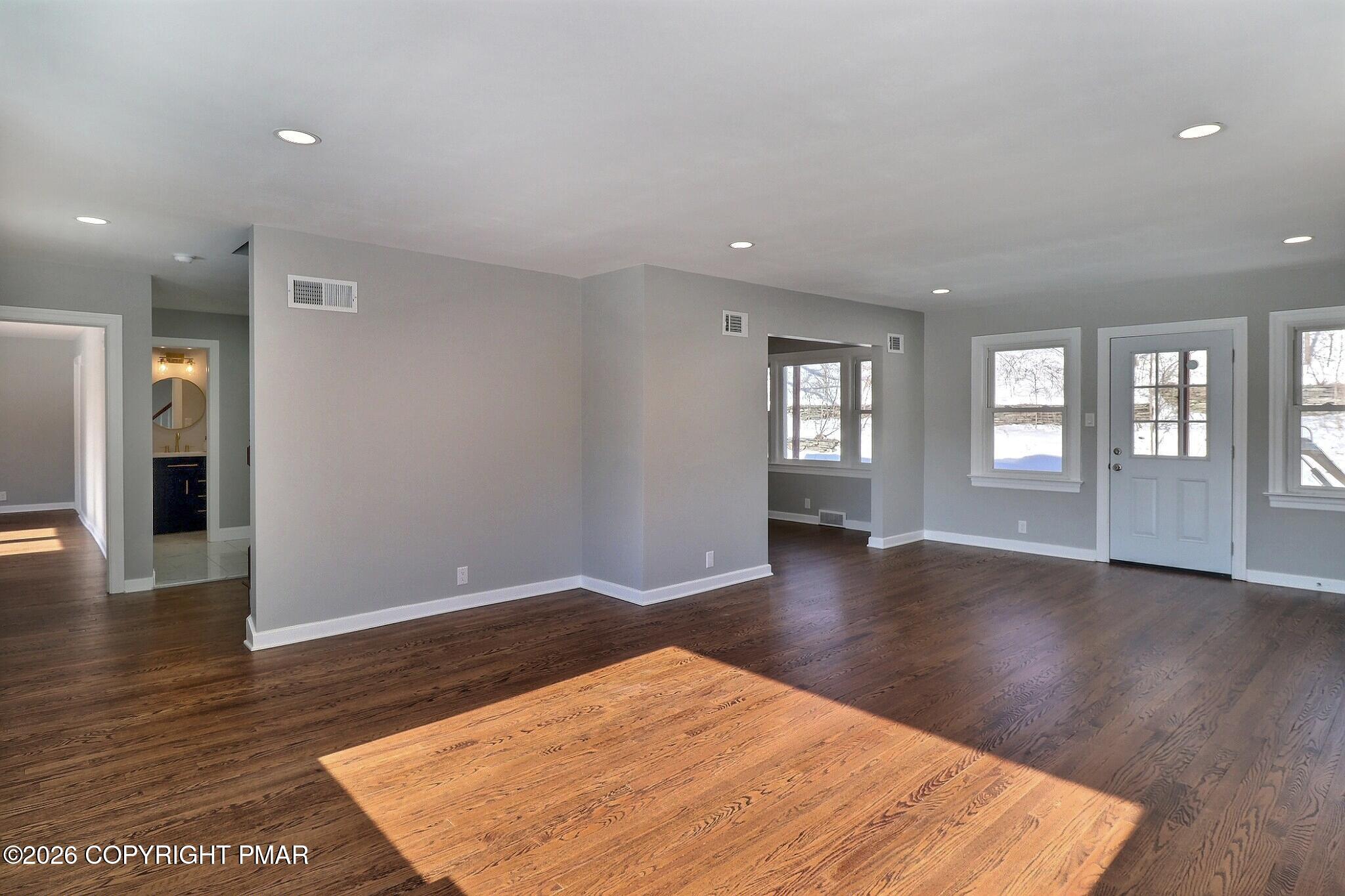 230 Colbert Street Stroudsburg, PA 18360 - Photo 18 of 43 wooden floor in an empty room with a window
