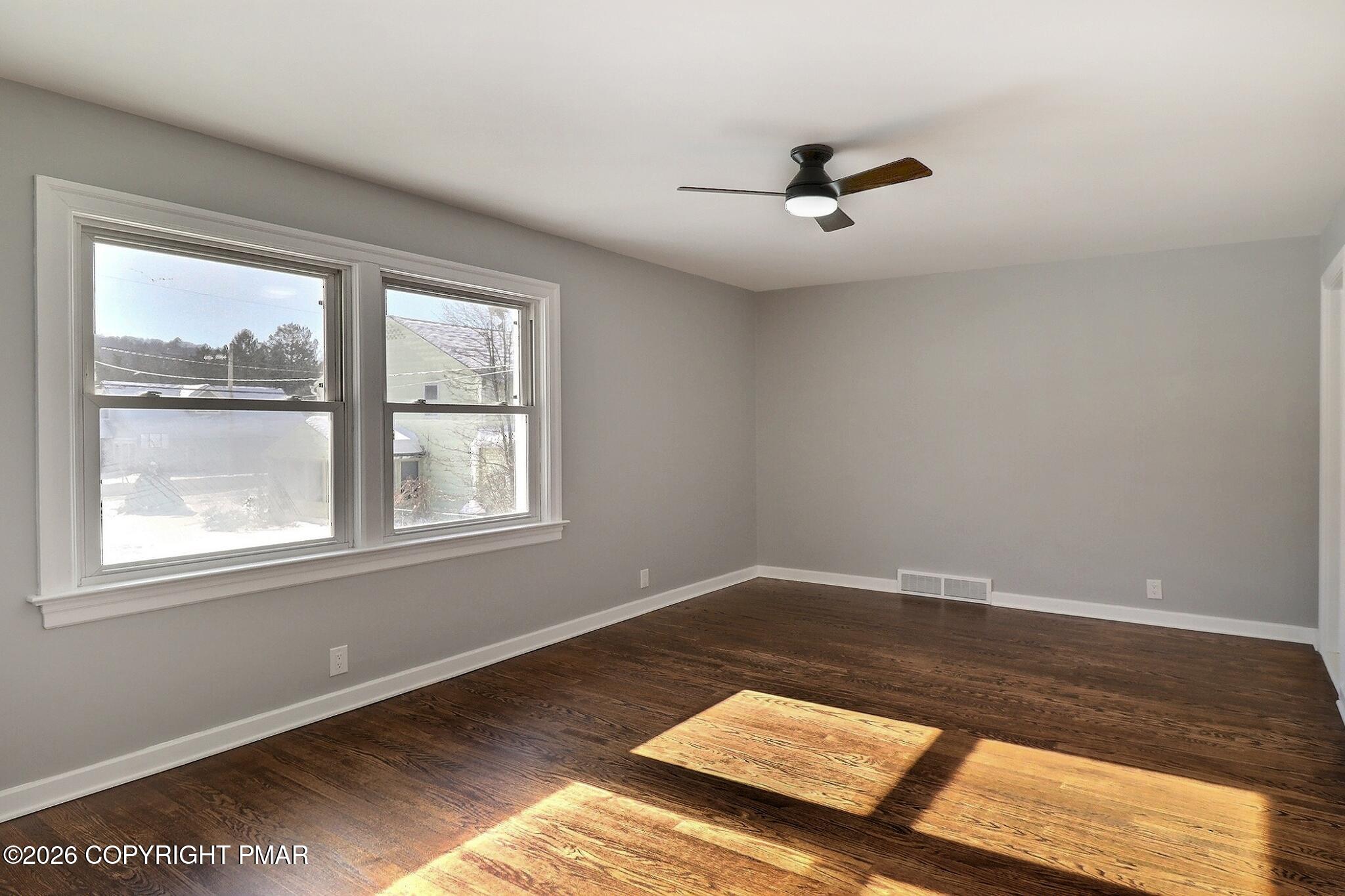230 Colbert Street Stroudsburg, PA 18360 - Photo 24 of 43 a view of a room with wooden floor and windows