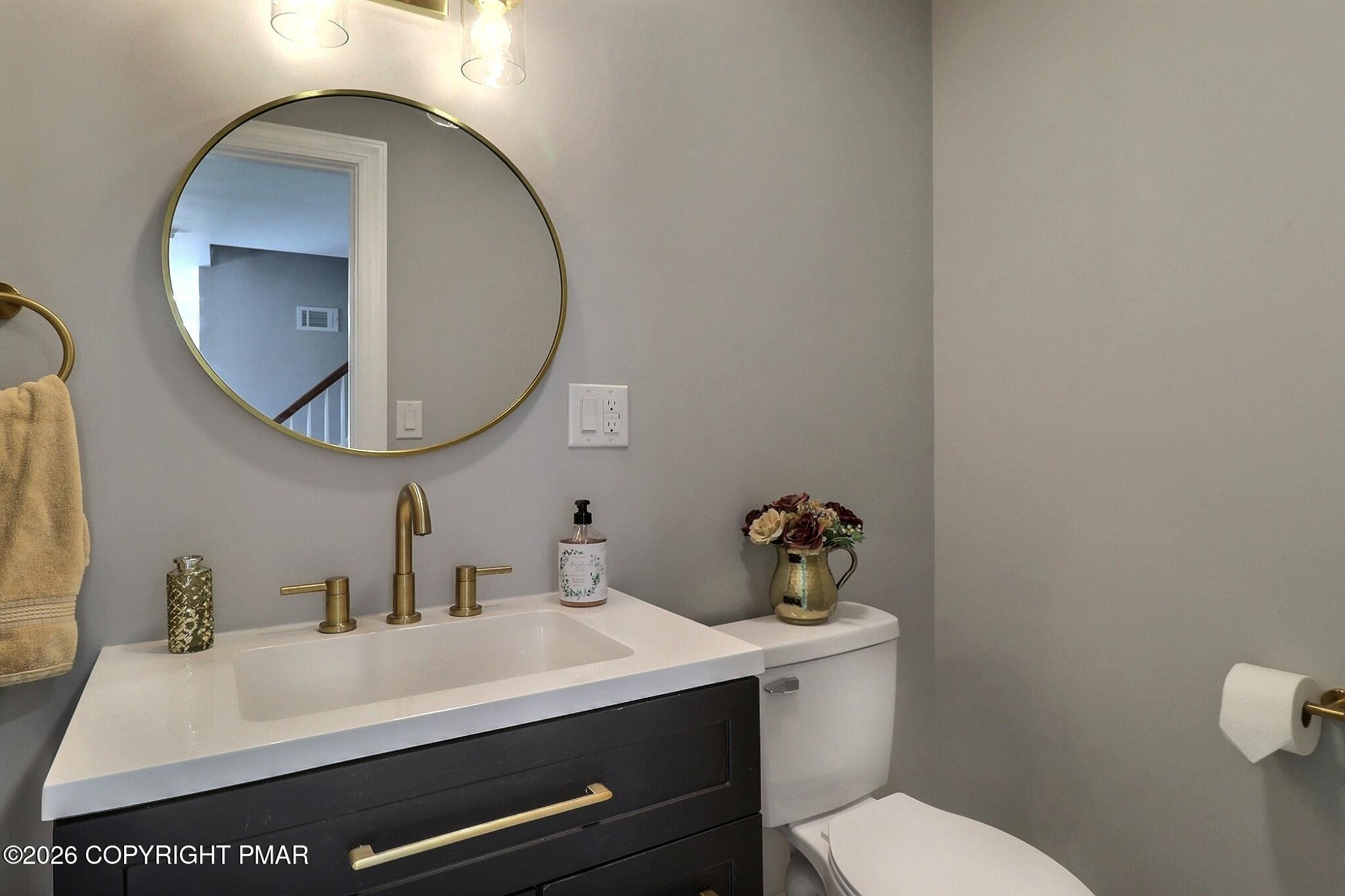 230 Colbert Street Stroudsburg, PA 18360 - Photo 27 of 43 a bathroom with a sink mirror and toilet