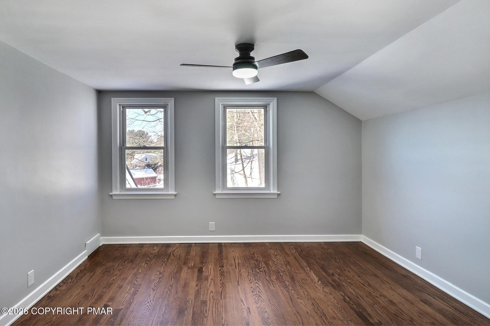 230 Colbert Street Stroudsburg, PA 18360 - Photo 35 of 43 a view of an empty room with wooden floor and a window