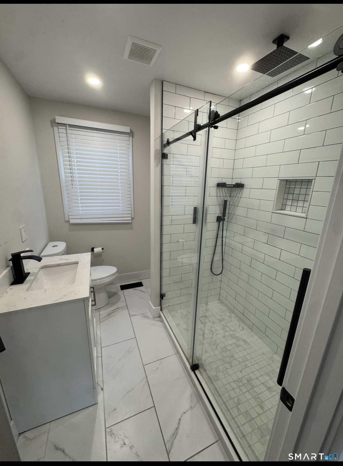 35 Knapps Highway Fairfield, CT 06825 - Photo 11 of 21 a bathroom with a granite countertop sink a toilet and shower