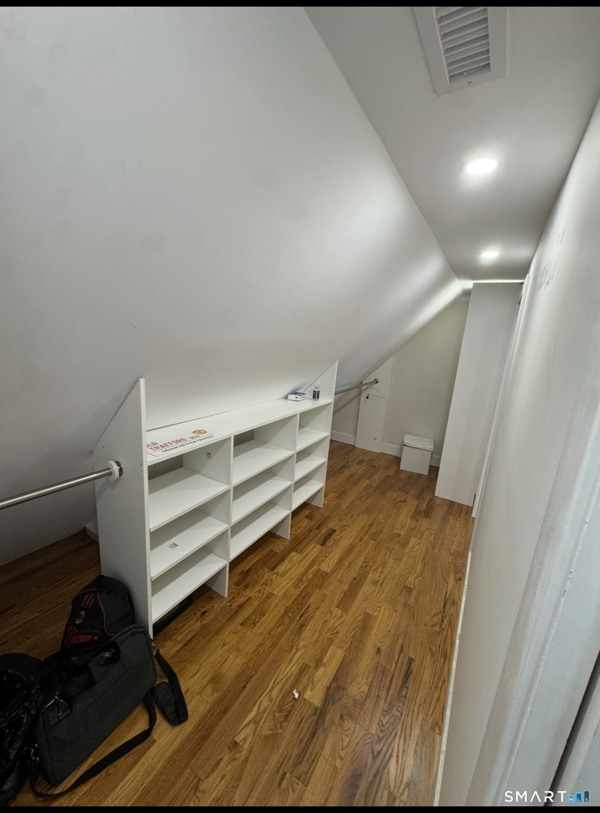 35 Knapps Highway Fairfield, CT 06825 - Photo 13 of 21 a view of walk in closet with empty racks