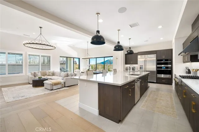 a kitchen with a counter space a sink and appliances