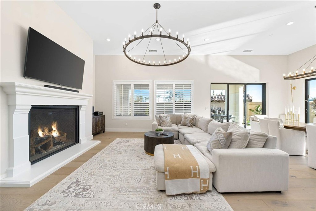 80467 Old Ranch Trail South La Quinta, CA 92253 - Photo 18 of 55 a living room with furniture a flat screen tv and a fireplace