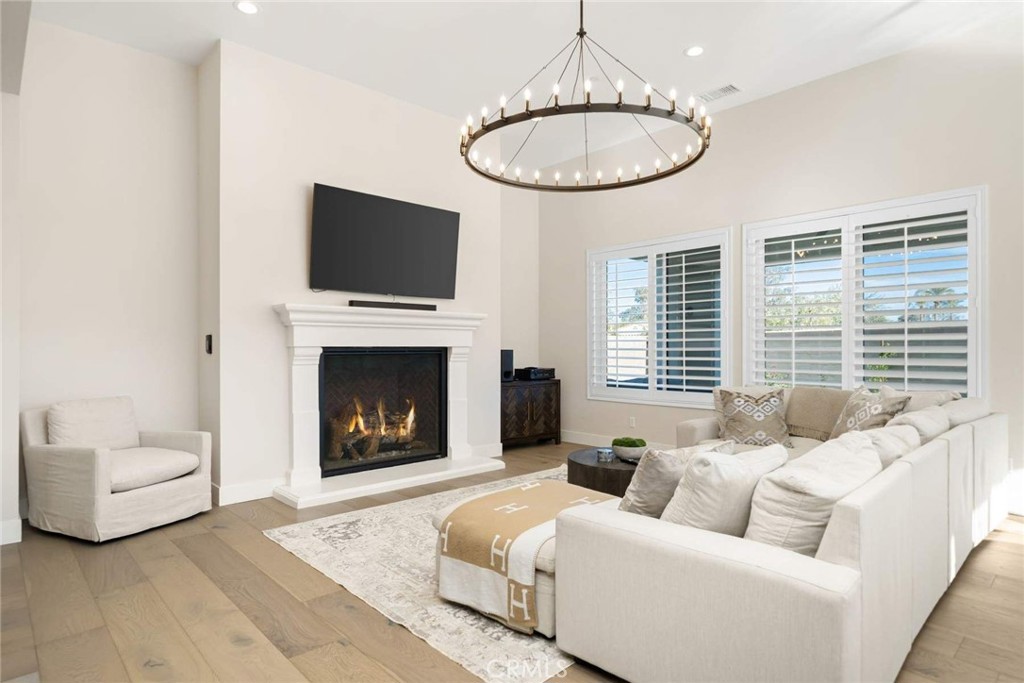 80467 Old Ranch Trail South La Quinta, CA 92253 - Photo 19 of 55 a living room with furniture a flat screen tv and a fireplace