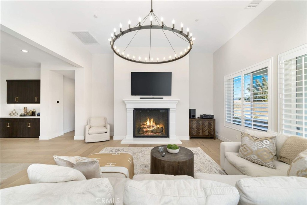 80467 Old Ranch Trail South La Quinta, CA 92253 - Photo 20 of 55 a living room with furniture a fireplace and a flat screen tv