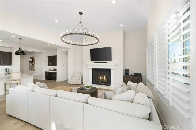 a very nice looking living room with furniture and a large window