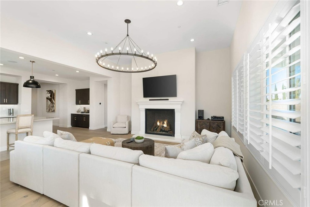 80467 Old Ranch Trail South La Quinta, CA 92253 - Photo 21 of 55 a living room with furniture a fireplace and a flat screen tv