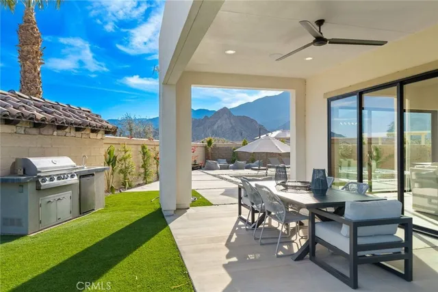 a view of a patio with swimming pool table and chairs
