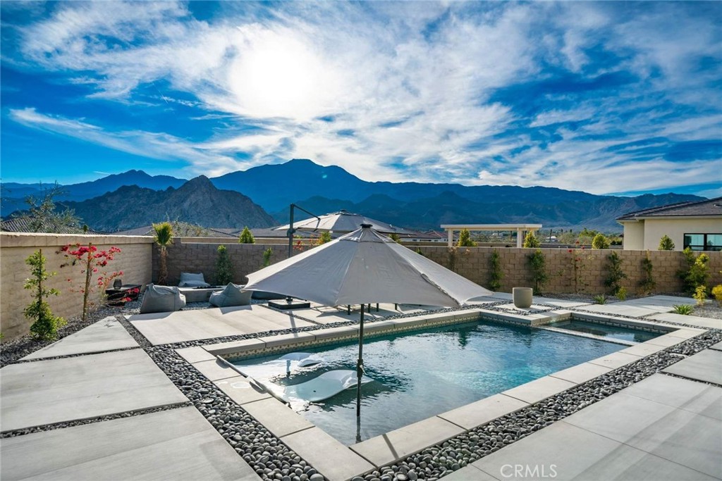 80467 Old Ranch Trail South La Quinta, CA 92253 - Photo 28 of 55 a view of a patio with swimming pool