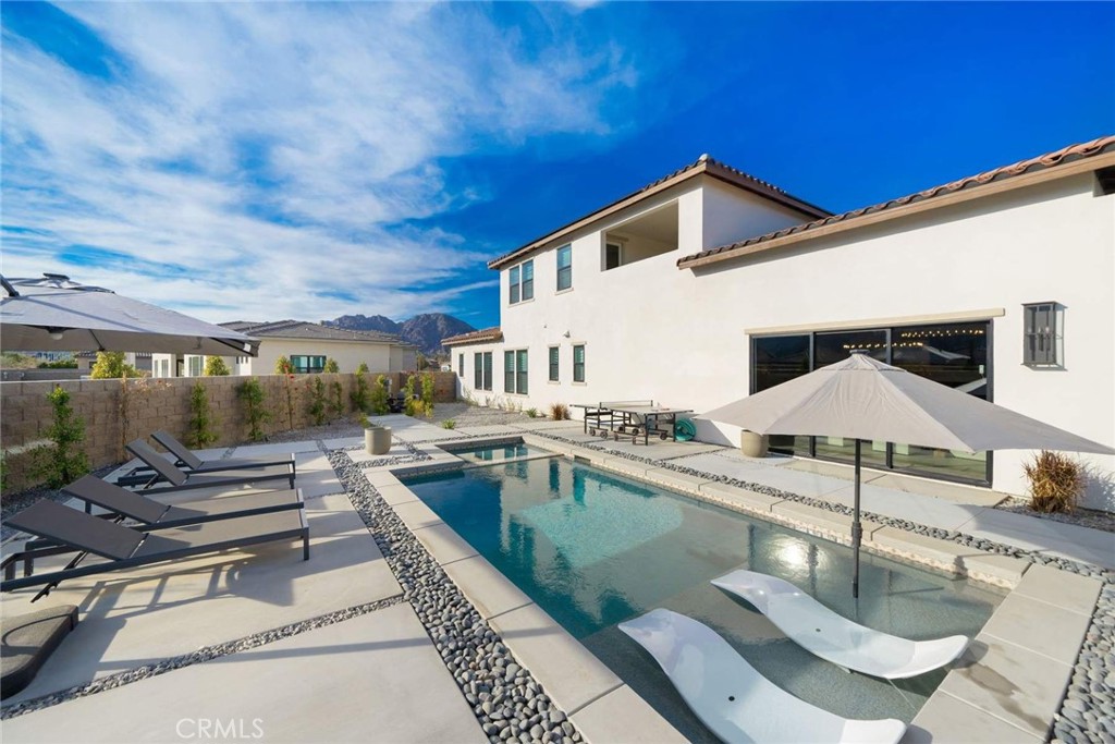 80467 Old Ranch Trail South La Quinta, CA 92253 - Photo 29 of 55 a backyard of a house with seating space