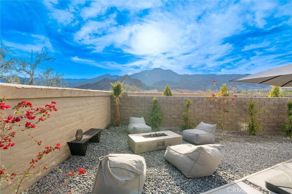 80467 Old Ranch Trail South La Quinta, CA 92253 - Photo 30 of 55 a view of a patio with couches and potted plants