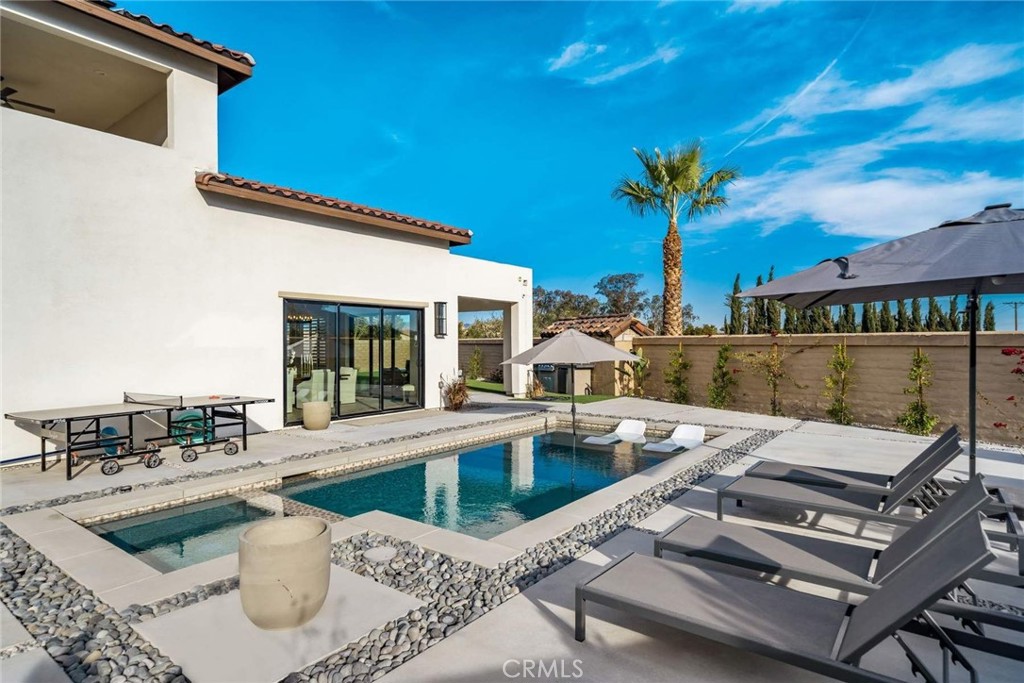 80467 Old Ranch Trail South La Quinta, CA 92253 - Photo 31 of 55 a view of a patio with swimming pool table and chairs