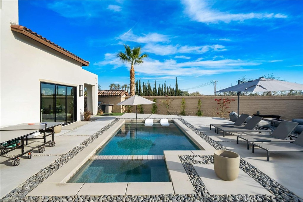 80467 Old Ranch Trail South La Quinta, CA 92253 - Photo 32 of 55 a view of a swimming pool with lounge chairs