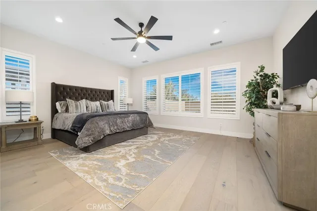 a bathroom with a bathtub a shower a sink and a window