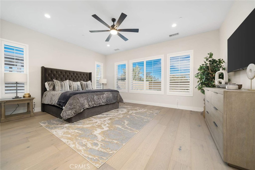 80467 Old Ranch Trail South La Quinta, CA 92253 - Photo 34 of 55 a bedroom with a large bed and a window